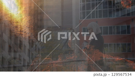 Image of landscape over businesswoman with coffee 129567534