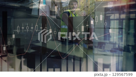 Image of graphs over caucasian male warehouse worker 129567599