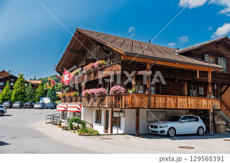 Charming Swiss Chalet Architecture Surrounded by Majestic Mountains in Grindelwald, Switzerland 129568391