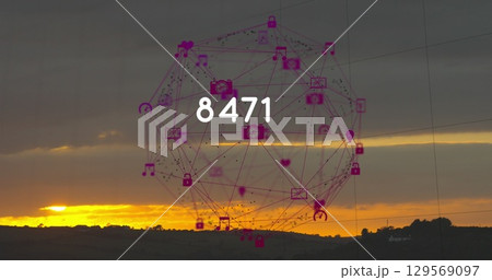 Image of growing number and globe of connections with icons over landscape 129569097
