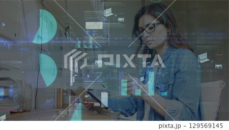 Image of data processing over caucasian businesswoman using tablet Image of data processing over caucasian businesswoman using tablet 129569145