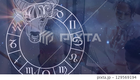 Image of zodiac sign over two diverse business people Image of zodiac sign over two diverse business people 129569194