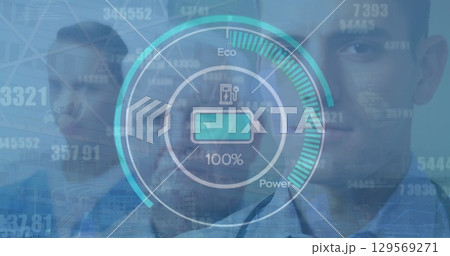 Image of graphical electric car gauge indicator showing battery charging over caucasian doctors 129569271