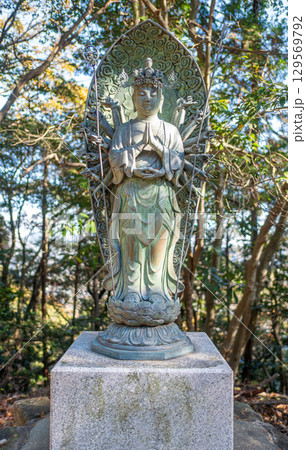 Buddhist statue surrounded by trees in nature at Engyoji mountain Shosha, Himeji, Japan 129569792