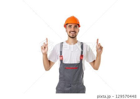 Enthusiastic male worker in safety helmet, isolated on white, PNG 129570448