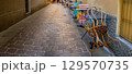 Narrow Italian street. Multicolor table in cafe outdoor 129570735
