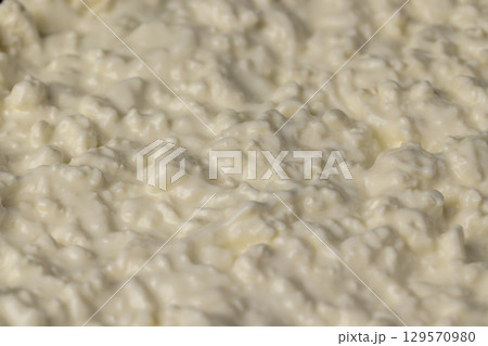 low-fat cottage cheese made from white milk with sour cream, sprinkled with liquid sour cream low-fat cottage cheese made from white milk with sour cream, sprinkled with liquid sour cream 129570980