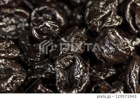 a large amount of prunes used in cooking, black prunes from small plums are dehydrated and pitted 129571043