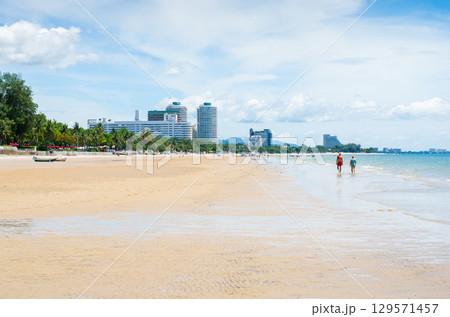 Beach scene with skyline and calm waters. Beach scene with skyline and calm waters. 129571457