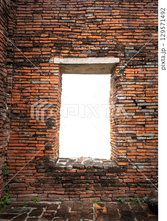 Brick wall with a window opening. 129571492