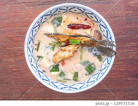 Thai spicy soup with fish and herbs Thai spicy soup with fish and herbs 129571516