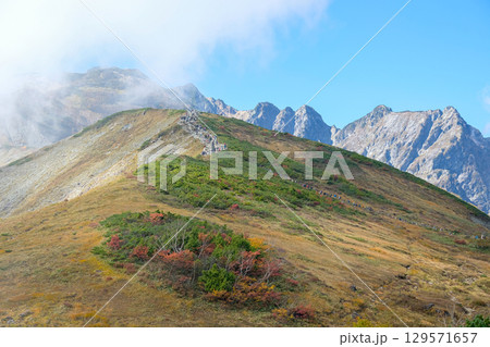 Happo Alpen Line Nature trail, Hakuba, Nagano, Japan, Mountainous landscape with greenery and clouds Happo Alpen Line Nature trail, Hakuba, Nagano, Japan, Mountainous landscape with greenery and clouds 129571657