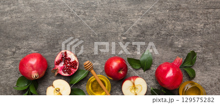 Flat lay composition with symbols jewish Rosh Hashanah holiday attributes on colored background, Rosh hashanah concept. New Year holiday Traditional. Top view with copy space 129575282