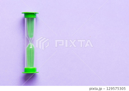 hourglass on the table, sand clock as time passing concept for business deadline, copy space hourglass on the table, sand clock as time passing concept for business deadline, copy space 129575305