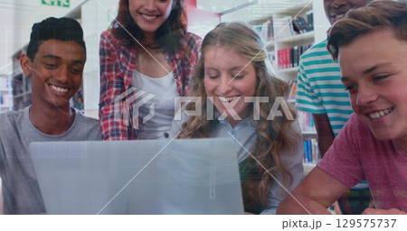 Image of multiracial student discussing using laptop over globe, trading board and graph Image of multiracial student discussing using laptop over globe, trading board and graph 129575737