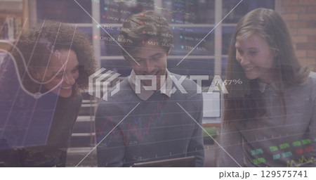 Image of graphs over diverse coworkers in office 129575741
