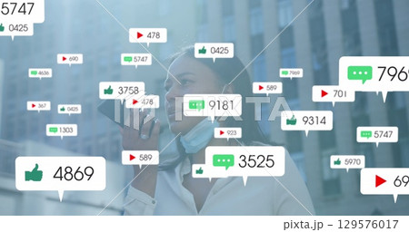 Image of social media icons with growing numbers over african american woman using smartphone 129576017