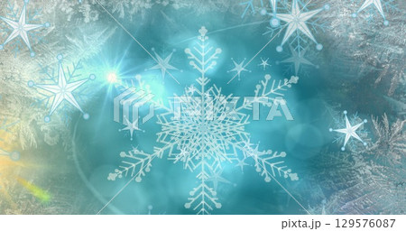 Image of light spots over snow falling Image of light spots over snow falling 129576087