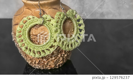 Round green earrings made of thin cotton threads, hand-knitted. Handmade. 129576237