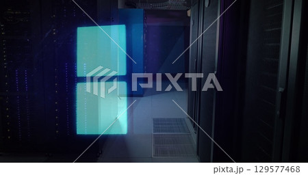 Image of snow falling over houses in night winter landscape 129577468