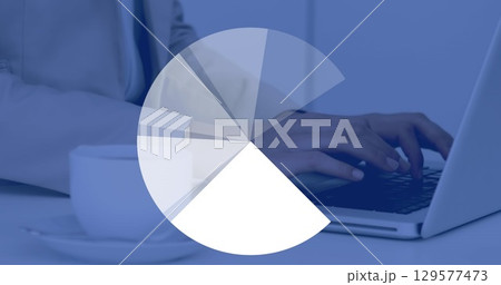 Image of pie chart rotating in loop over midsection of caucasian businessman using laptop 129577473