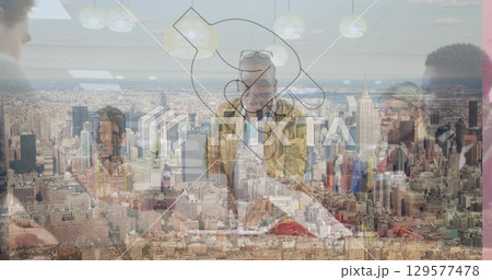 Image of hand icon over diverse businesspeople in office and cityscape 129577478