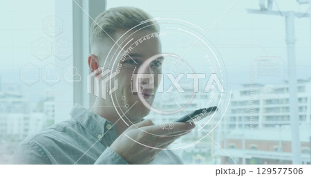 Image of data processing over caucasian men using smartphone 129577506