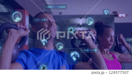 Image of data processing over couple exercising at gym 129577507