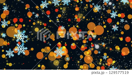 Image of snowflakes over light spots on black background 129577519