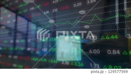 Image of financial data processing over flickering blue squares caucasian woman using smartphone 129577569