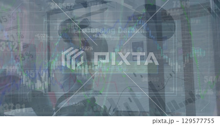 Image of data processing over caucasian businessman using vr headset at office Image of data processing over caucasian businessman using vr headset at office 129577755