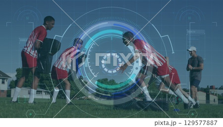 Image of scope and data processing over diverse football players exercising on pitch 129577887