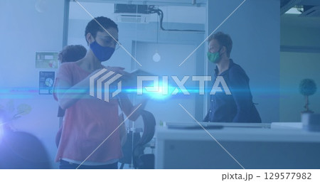 Image of diverse business people with face masks in office Image of diverse business people with face masks in office 129577982