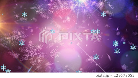 Image of light spots over snow falling Image of light spots over snow falling 129578053