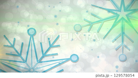 Floating turquoise snowflake cluster over digital backdrop creating bokeh and small snowflake icons 129578054