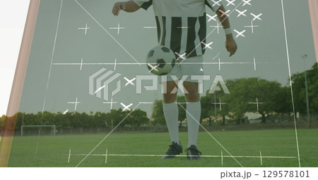 Image of game plans over caucasian football player at stadium 129578101