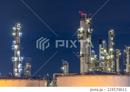 Oil and gas refinery plant at night, Global business energy logistic transportation, Oil and gas refinery petrochemical industrial, Petrochemical refinery industrial energy supply chain. Oil and gas refinery plant at night, Global business energy logistic transportation, Oil and gas refinery petrochemical industrial, Petrochemical refinery industrial energy supply chain. 129578611