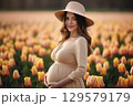 Man and woman holding pregnant bump expecting baby. Happy family hands on stomach closeup. 129579179