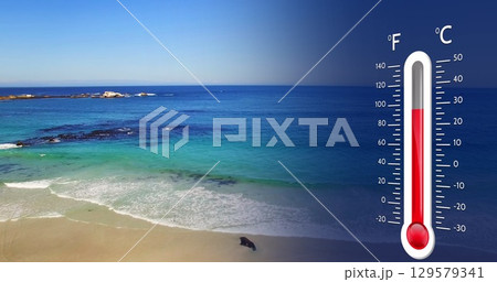 Image of digital thermometer over sea landscape 129579341