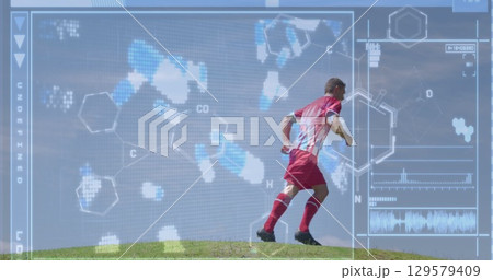 Image of screen with biological data over caucasian male soccer player during training 129579409
