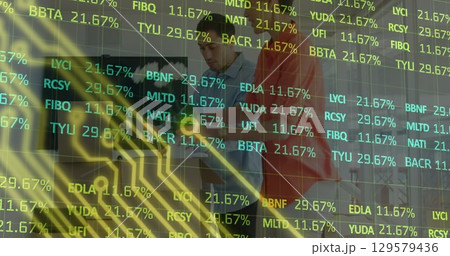 Image of financial data over diverse coworkers in office 129579436