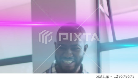 Image of light trails over african american male teacher Image of light trails over african american male teacher 129579575