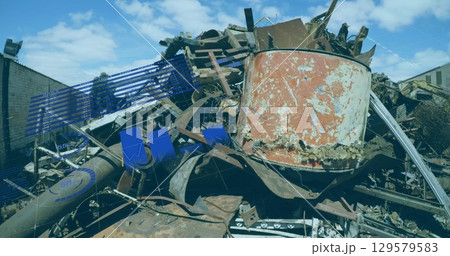 Displaying heap of rusted metal scraps at scrap yard, with corroded tank pipes beams chart overlay 129579583