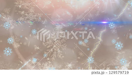 Image of light spots over snow falling Image of light spots over snow falling 129579719