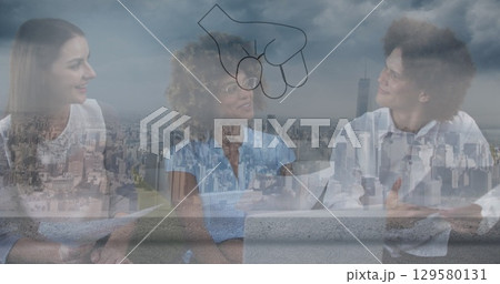 Digital composite image of multiracial colleagues discussing in modern office, city in background 129580131