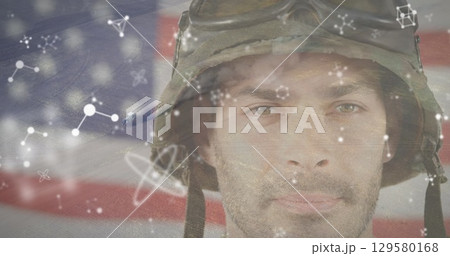Image of graphics rotating over portrait of caucasian young army soldier and landscape 129580168