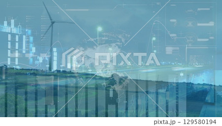 Image of graphs moving over wind turbine field, globe against cityscape 129580194