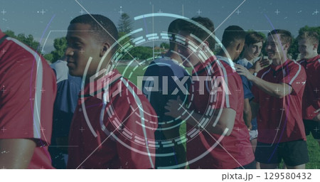 Image of scope and data processing over two teams of diverse male football players in field Image of scope and data processing over two teams of diverse male football players in field 129580432