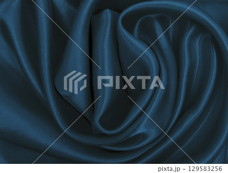 Smooth elegant blue silk or satin luxury cloth texture as abstract background. Luxurious background design Smooth elegant blue silk or satin luxury cloth texture as abstract background. Luxurious background design 129583256