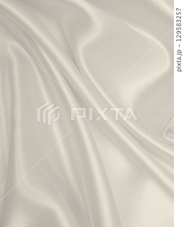 Smooth elegant golden silk or satin luxury cloth texture as wedding background. Luxurious background design. In Sepia toned. Retro style 129583257